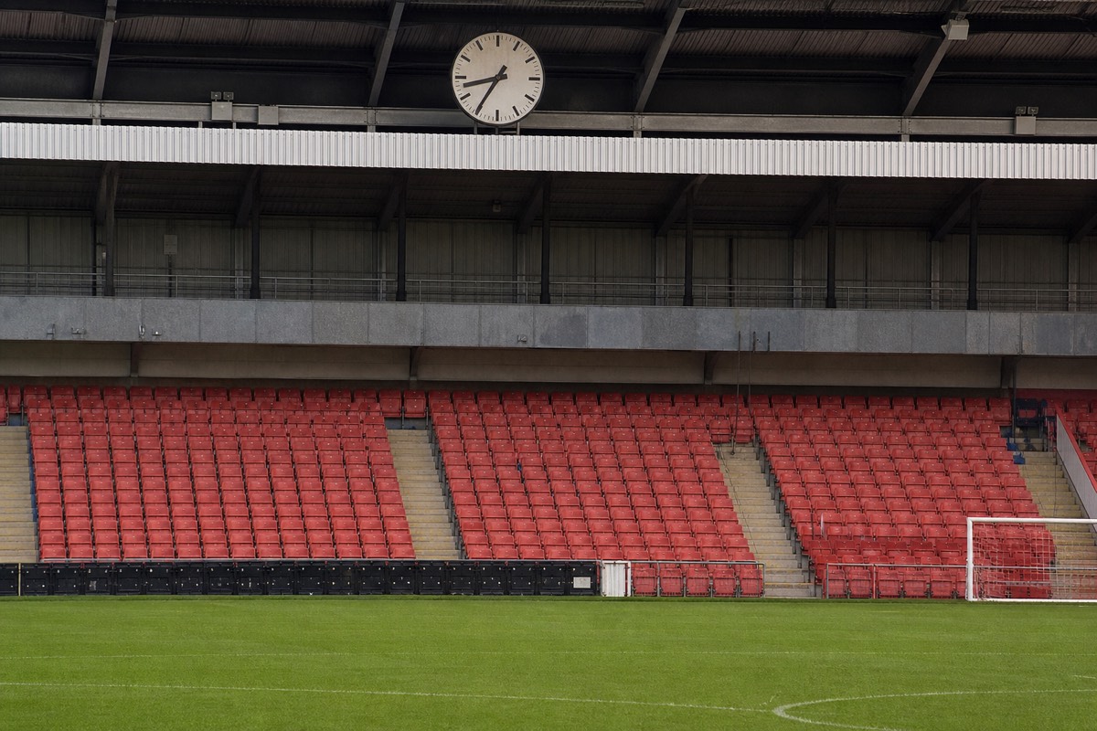 The pitch and stands of Anfield stadium during a tour